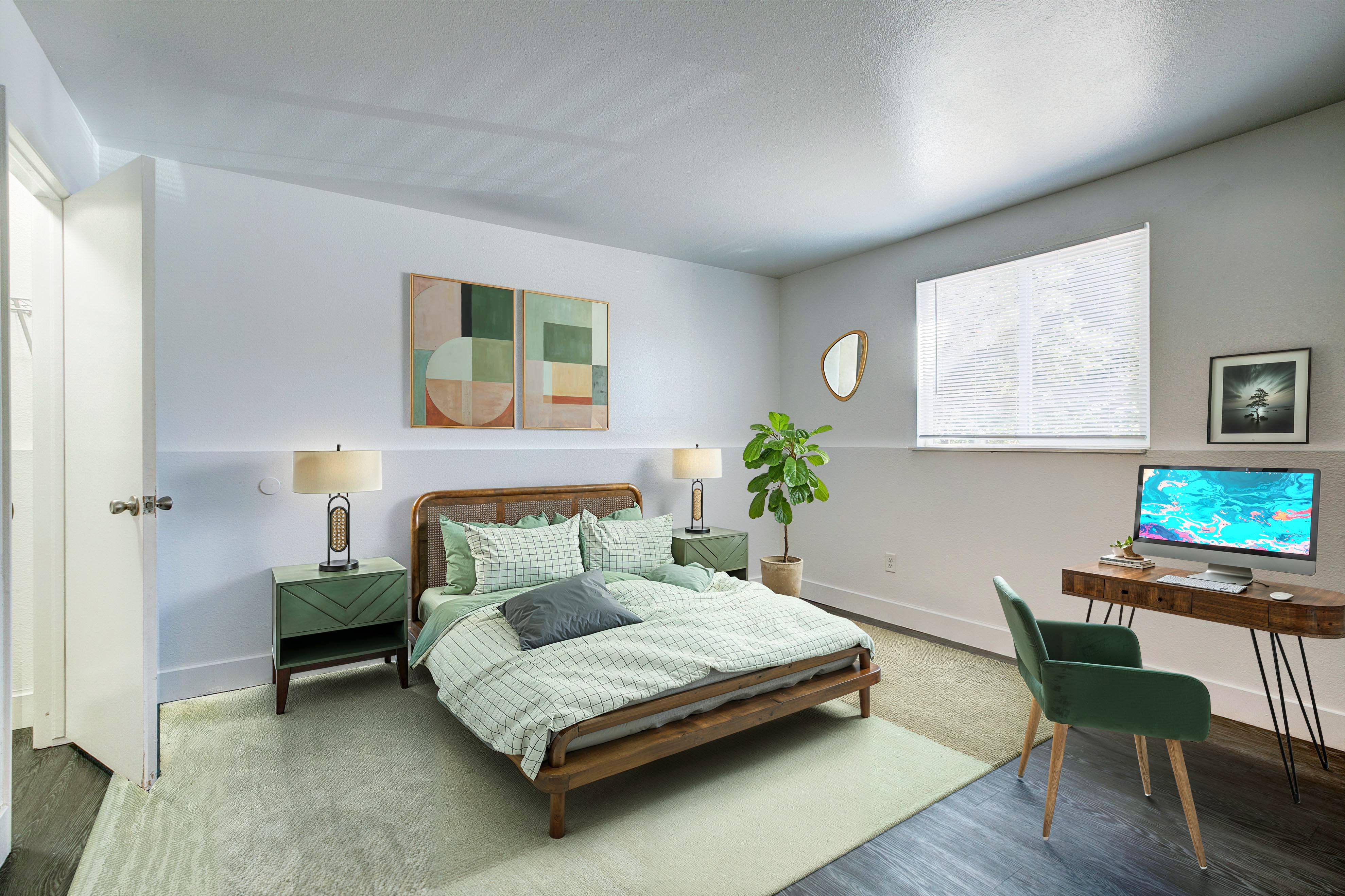 A bedroom with a bed, desk, and chair.,A bedroom with a bed, desk, and chair.